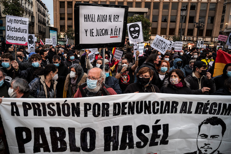 Protesters with placards during a demonstration to protest Protesters with placards during a demonstration to protest